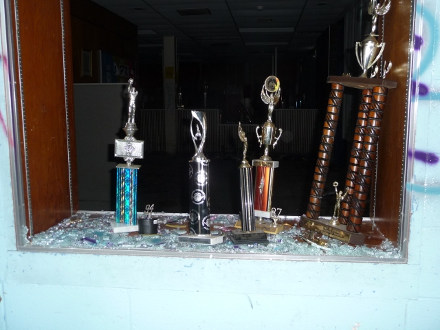 Whats left of one of the school trophy display cases.  Obviously smashed by vandals,  trophies were tossed all over the lower floor.
